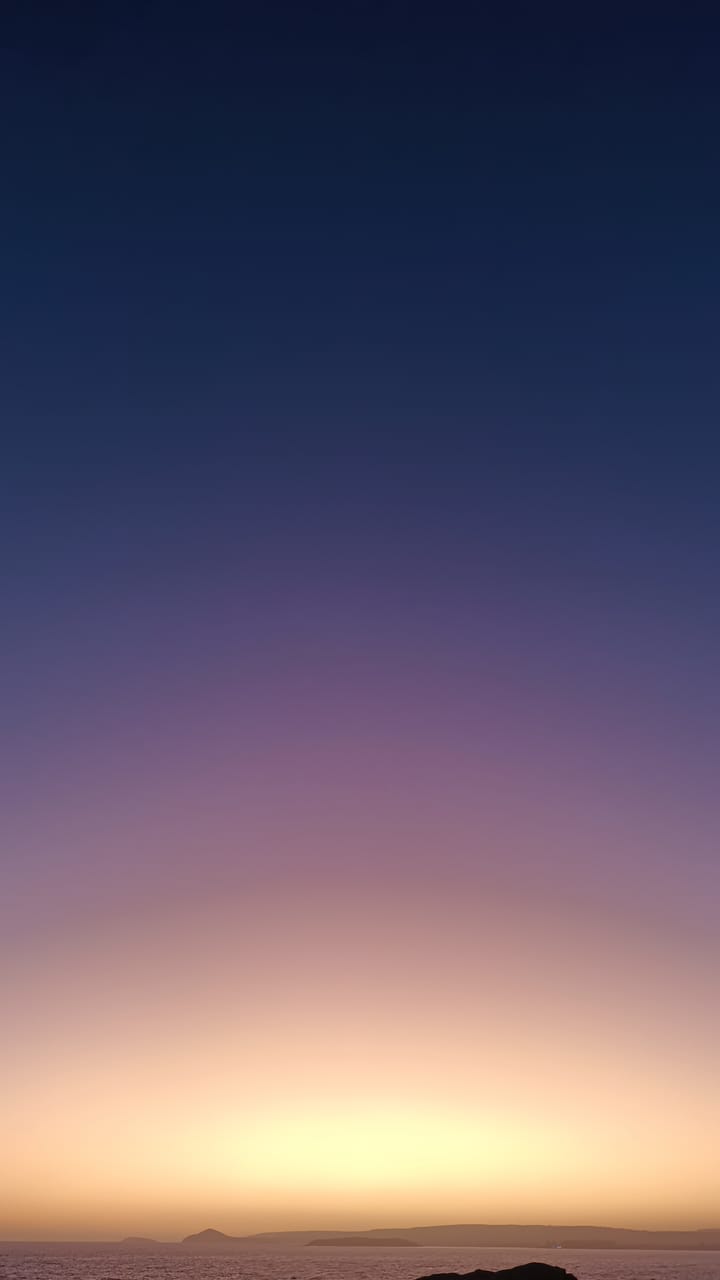 View over Encounter Bay from Port Elliot in sunset. Purple and yellow skies.